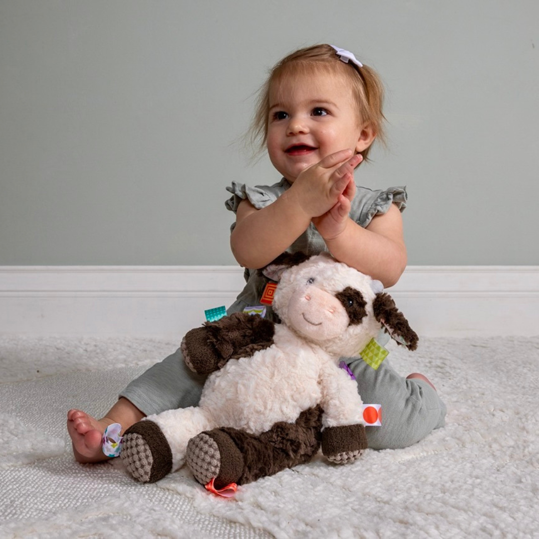 Peluche de Estimulación Sensorial Taggies Buttercup Cow